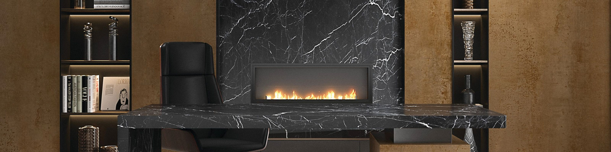 Home office with bookshelves of metallic looking porcelain slab and fireplace surround of black marble look porcelain slab, and desk made of porcelain slab that looks like black marble.