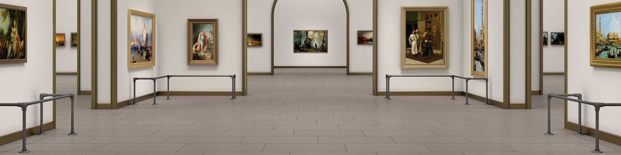 Art gallery with towering ceiling, arched doorways, gray floor tile that looks like concrete, and paintings hanging on the walls protected by railings.