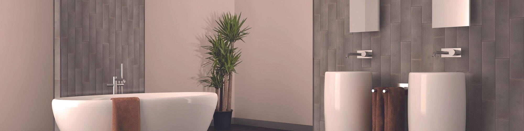 Bathroom with pewter metallic-look tile arranged in a vertical pattern, soaker tub and two pedestal vanities.